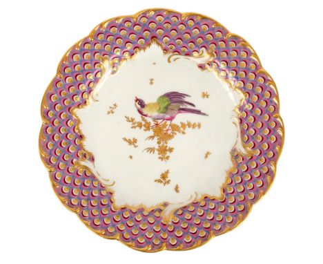 A Chelsea gold anchor plate, circa 1760, painted a bird on a branch within a gilt feather and scroll border, 22cm wide/Proven