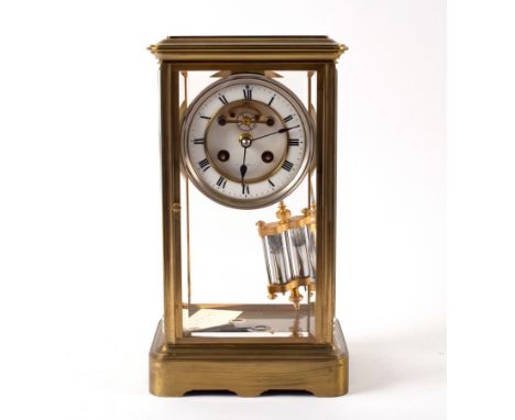 A French four-glass brass mantel clock, the dial with skeleton escapement signed J Bennett and with mercury compensating pend