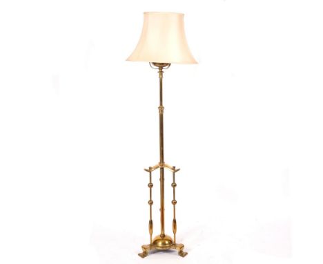 An early 20th Century brass telescopic standard lamp with triple-column base CONDITION REPORT: The extension pillar is all bu