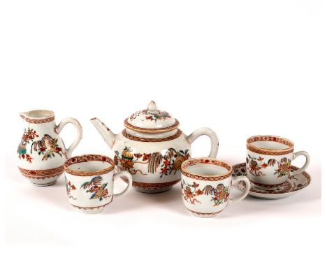 A mid 18th Century Chinese famille rose part tea set, comprising a bullet-shaped teapot and cover, three cups and a saucer, a