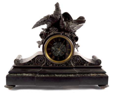 A black slate mounted clock with bird surmount, 60cm wide CONDITION REPORT: The clock has no pendulum, there are no noticeabl