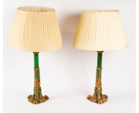 A pair of gilt metal mounted lamp bases, 61cm high with pleated shades CONDITION REPORT: Both lamp columns with slight damage