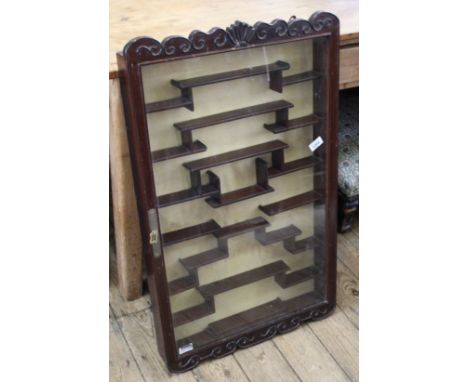 A late 19th Century Oriental hardwood glazed display cabinet with section shelf interior