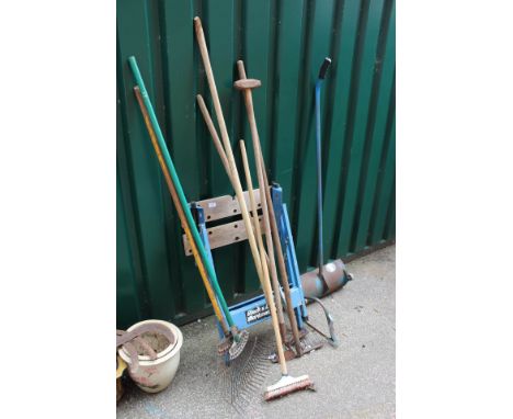 Assorted garden tools and a workmate