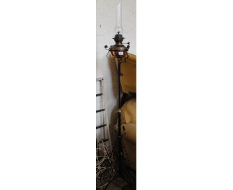 A brass and iron standard oil lamp