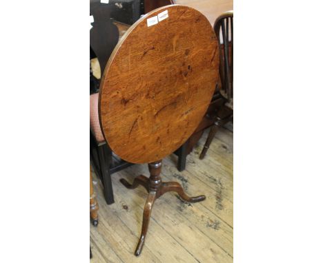 A Victorian oak tilt top tripod table