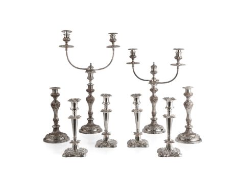A suite of four table plated candlesticks plate on copper, comprising four table candlesticks and a pair of three-light cande