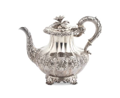 Y A George IV waterpot London 1827, of baluster form, the lower body with chased foliate and floral decoration to a ground bo