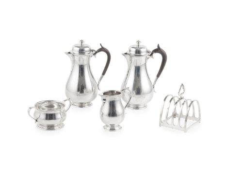 A George V matched cafe-au-lait set The Barnards, London 1916/7, comprising a waterpot, a coffee pot, a cream jug, and associ