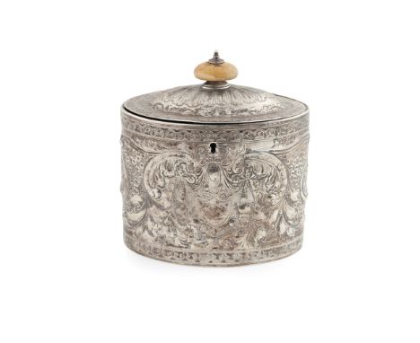 Y A George III tea caddy W.S, London 1790, of oval form, all over embossed floral shell and scroll decoration, vacant shield 