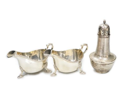 A pair of Elizabeth II silver sauceboats, Adie Bros., Birmingham, 1958 and an earlier engine turned silver sugar caster, gros