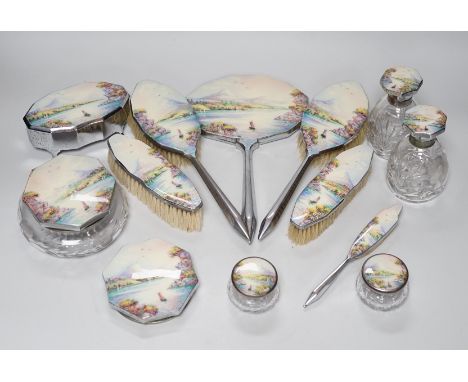 A twelve piece chrome plated and enamel dressing table set