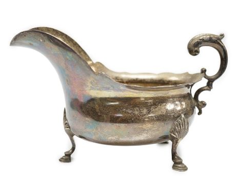 A late Victorian silver sauce boat, with flying scroll handle, Charles Boyton, London, 1897, length 21.6cm, 14.1oz.