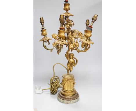 An ornate six branch ormolu cherub candelabrum, converted to a lamp, 54cms high