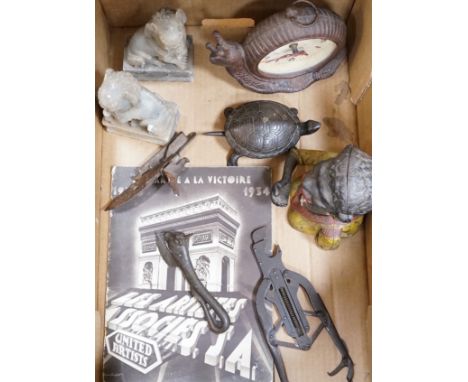 A metal figural money box, a pair of hardstone temple dogs, a novelty snail clock, metal tools and a United Artists 1930 illu