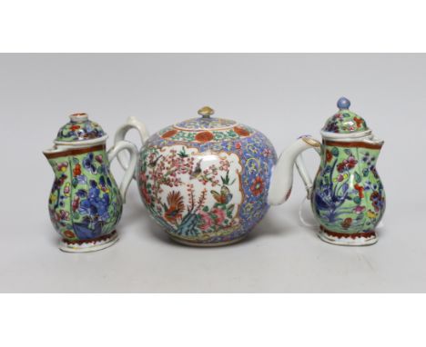 Two Chinese Kangxi clobbered jugs and covers, and a 19th century famille rose teapot, 13cms high