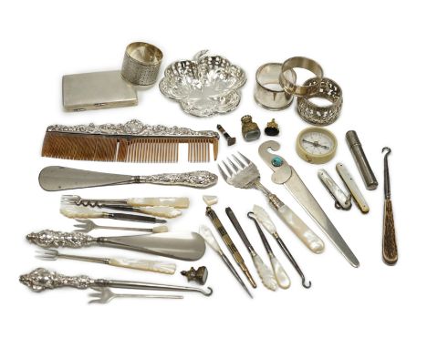 A group of assorted small silver and white metal items, including a small late Victorian clover shaped nut dish, napkin rings