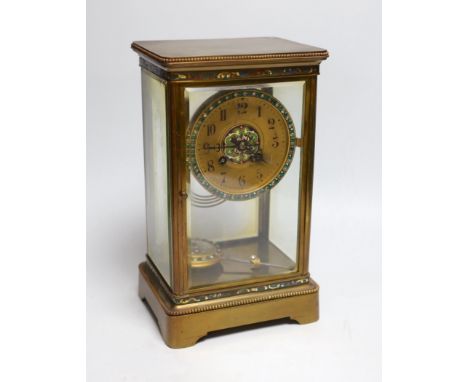 An early 20th century four glass brass and champleve enamel clock, with decorative enamelled and paste dial and pendulum, 7cm