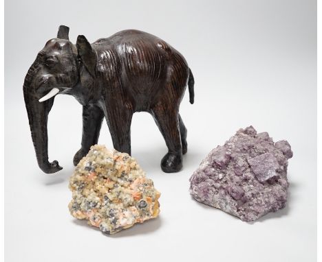 Two specimens; amethyst and rock crystal, and a leather model of an Indian elephant, 24cm high