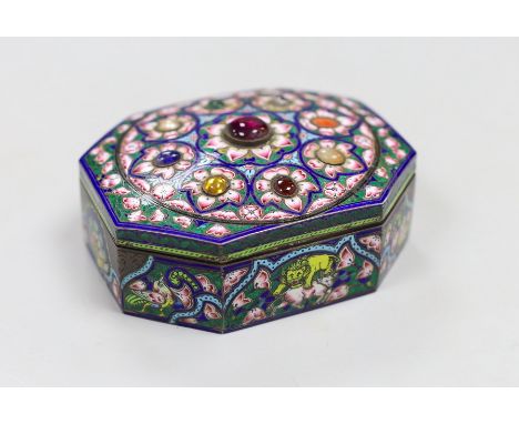 An early 20th century Indian gem set and enamelled gilt white metal trinket box, 10cm long