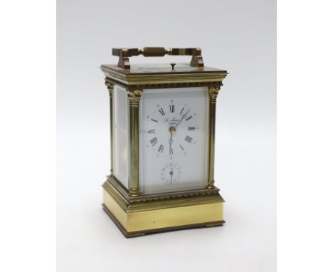 A large brass cased carriage clock retailed by St. James, 17cm