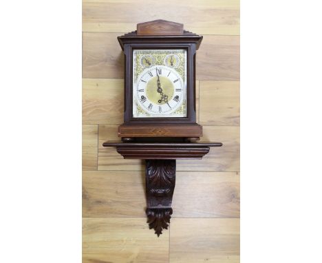 A Edwardian inlaid mahogany bracket clock, with traditional dial and chiming mechanism, clock 37cms high, bracket 33cms high