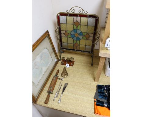 A Victorian embossed copper shot flask, postal scales and weights, plated items, a display knife and fork and a stained glass