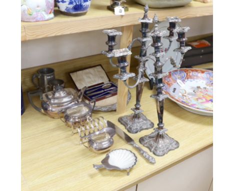 Assorted plated wares including a pair of three light candelabra, 52cms high