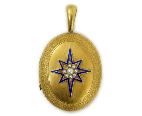 A Victorian engraved yellow metal, blue enamel and seed pearl set oval locket, 45mm, gross weight 21.2 grams.