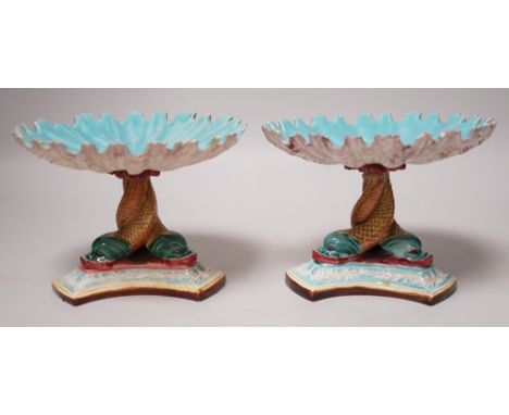 A pair of late 19th century Royal Worcester majolica dolphin comports, 10cm tall