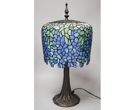 A Tiffany style stained glass lamp. 54cm tall
