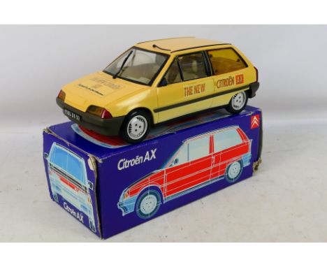 Vullierme / Vulli - A plastic promotional  model of a Citoen AX. The has some signs of play with fading to the body and decal