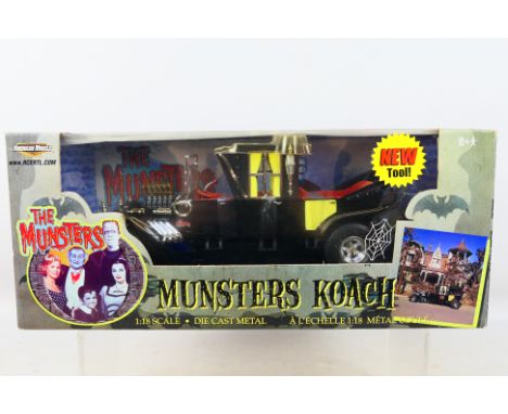 American Muscle - A boxed 1/18 scale Musters Koach (#36685). Item appears mint in an excellent box. (This does not constitute