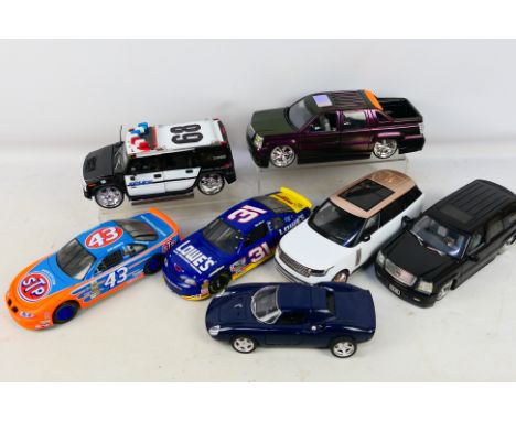 Burago - Revell - ERTL - Jada - 7 unboxed 1/18 scale diecast cars to include 2002 Cadillac Escalade, 2002 police hummer, Ferr