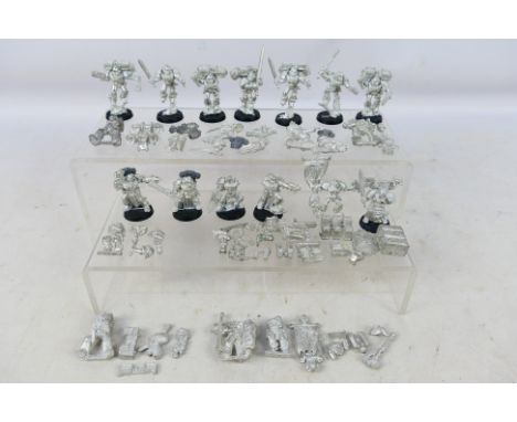 Warhammer - A collection of approximately 17 Warhammer 40K Space Marines metal figures in various poses, together with a quan