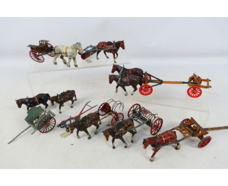 Britains - A collection of horses and wagons including a Timber Wagon with 2 x horses, a Roller with 1 x horse, a Rake with 1