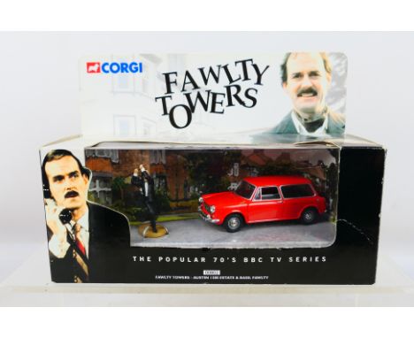 Corgi - A boxed #00802 'Fawlty Towers' Austin 1300 Estate & Basil Fawlty Figure. Item appears mint in a very good box; some b