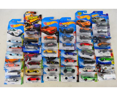 Hot Wheels - 40 factory sealed blister packed vehicles to include #FJY00 McLaren P1, #FJY03 Lotus Esprit S1, #L9923 2008 Firs