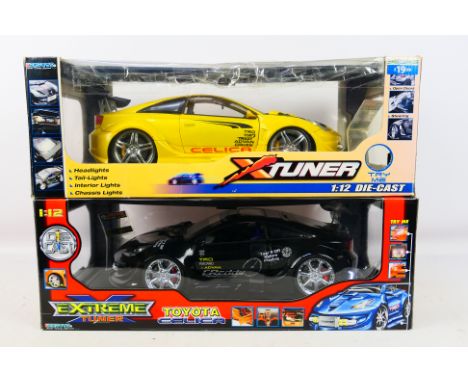 Kentoys - A pair of 1/12 scale battery powered Toyoya Celic vehicles; one black, one yellow. Items appear excellent-near mint