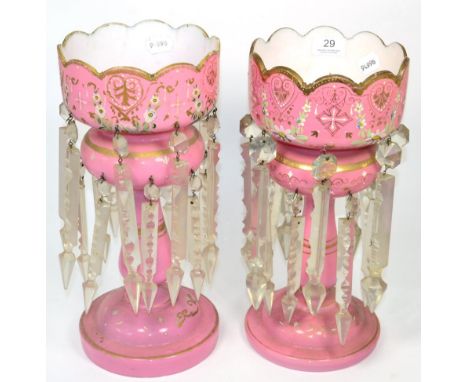 A near pair of pink opaque glass candlestick lustres, 36cm high 
