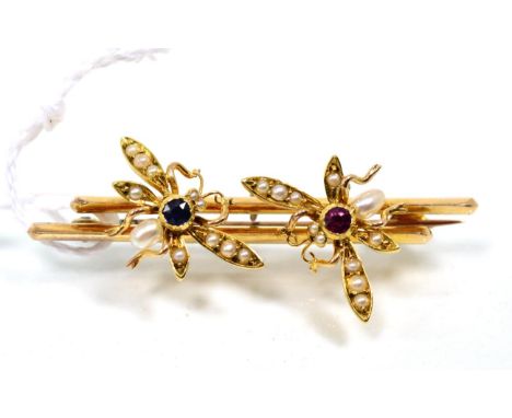 An early twentieth century ruby, sapphire and seed pearl fly brooch, measures 1.5cm by 4.5cm, 5.7g 