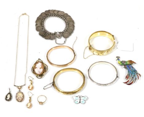 A 9 carat gold bangle, with foliate decoration, 800 standard enamel peacock brooch, an enamelled butterfly brooch and cameo j