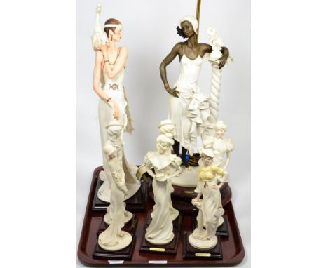 Seven Guiseppe Armani Florence figures and a table lamp