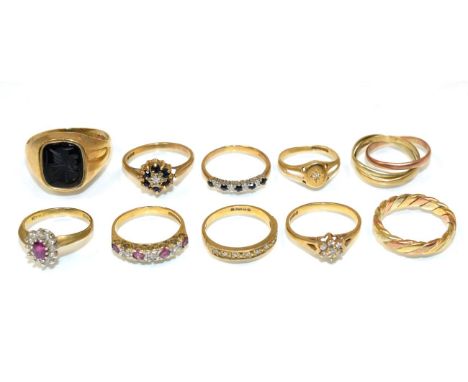 A 9 carat gold onyx intaglio signet ring, finger size V1/2, a 9 carat tri-colour gold twisted band ring, finger size J and ei