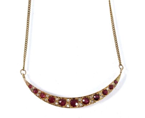A ruby and diamond crescent necklace, graduated round cut rubies spaced by rough cut diamonds, converted to a pendant from a 