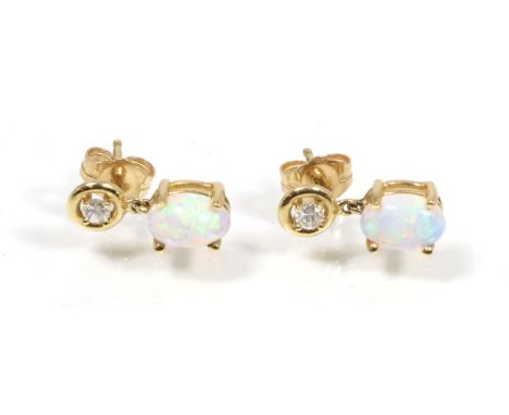 A pair of opal and diamond earrings, total estimated diamond weight 0.10 carat approximately, with post fittings, 2.1g 