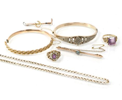 A seed pearl bangle (one pearl deficient), a twisted motif bangle stamped '9CT' (a.f.), two amethyst rings; a 9 carat gold bl
