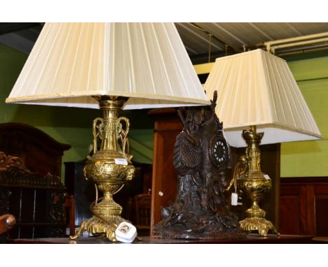 A pair of gilt brass lamp bases 