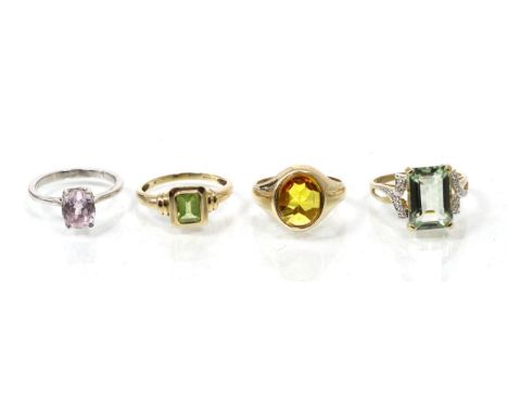 A 9 carat gold citrine ring, finger size R; a 9 carat gold peridot ring and two other gem set rings, 15.9g gross (4)