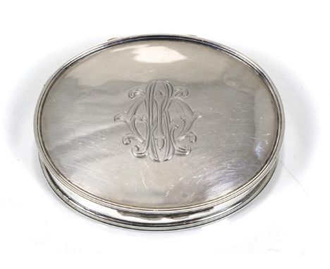 An oval silver snuff or tobacco box, Stokes & Ireland, Chester 1913, in the 18th Century style, the cover engraved with a mon